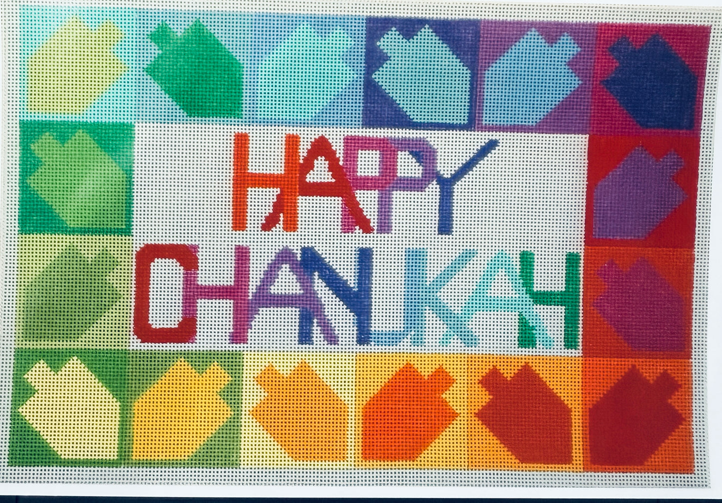 Happy Hanukkah canvas with colorful Dreidels.